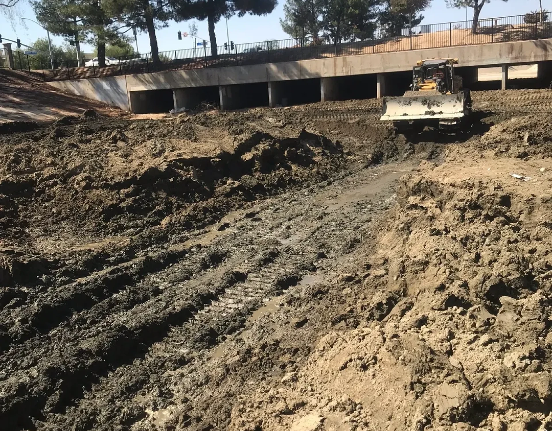 Bulldozer in muddy construction site